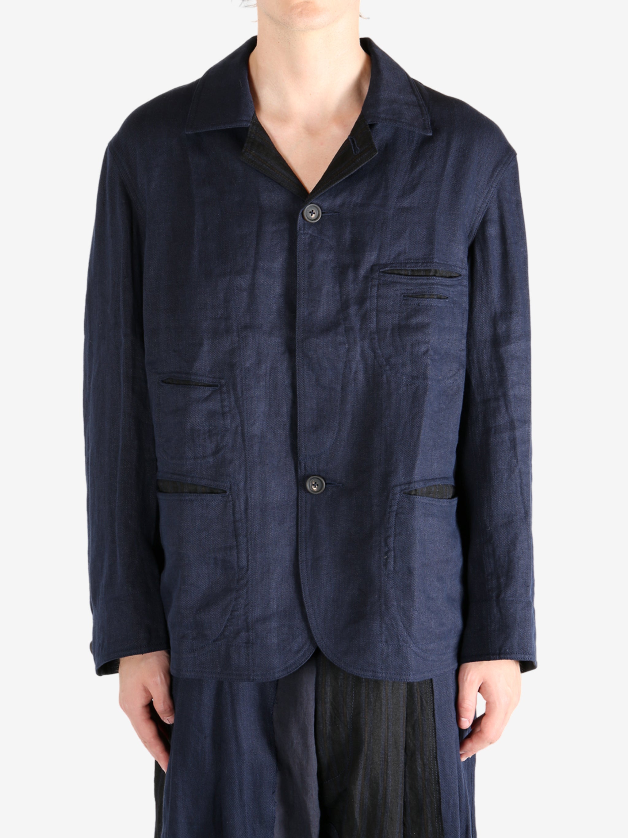 Blue jacket worn by a person, showing the jacket fit