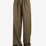 Green pant worn by a person, showing the pant's fit