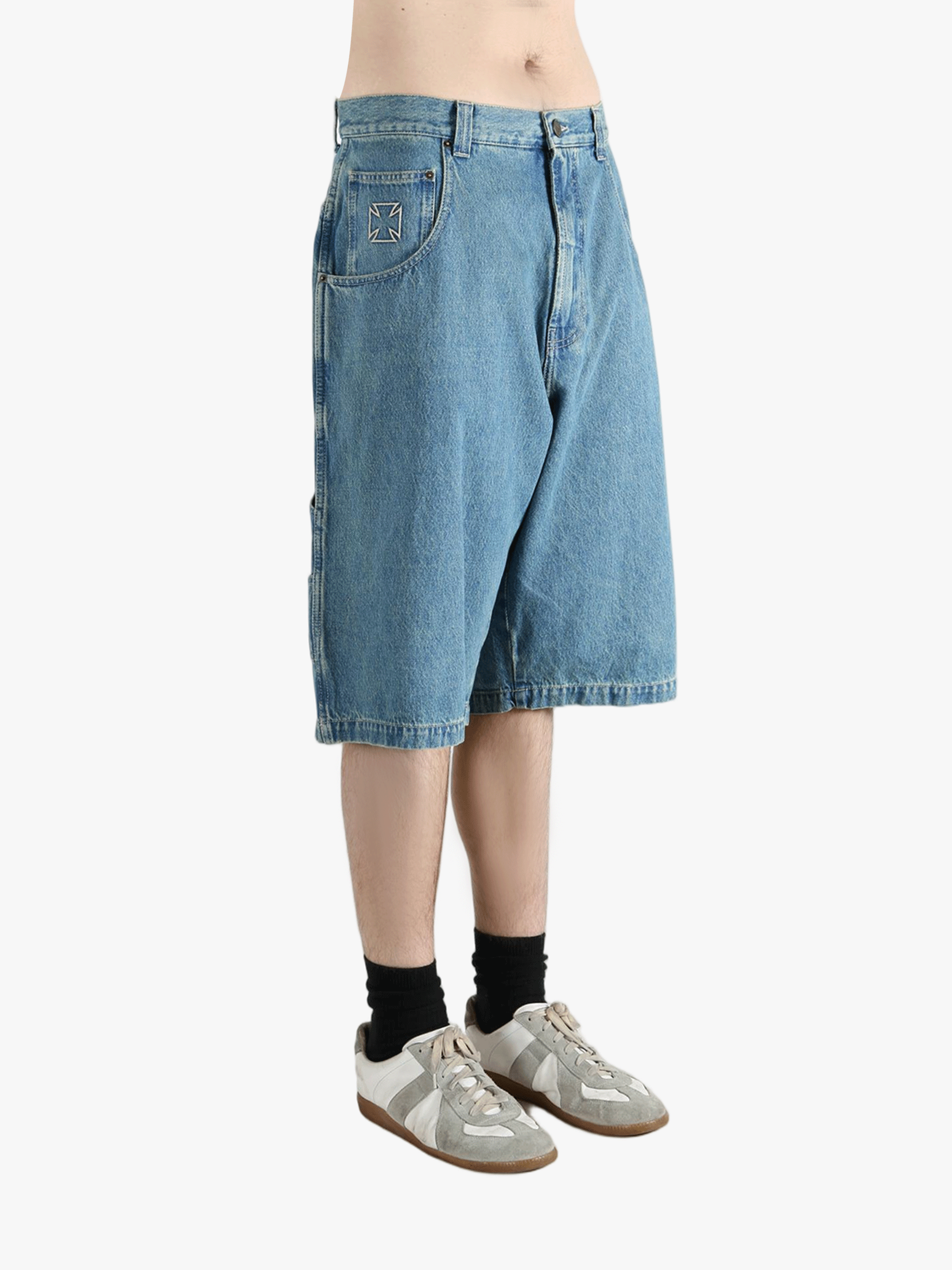 Blue short worn by a person, showing the fit