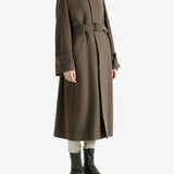 Brown coat worn by a person, showing the coat fit