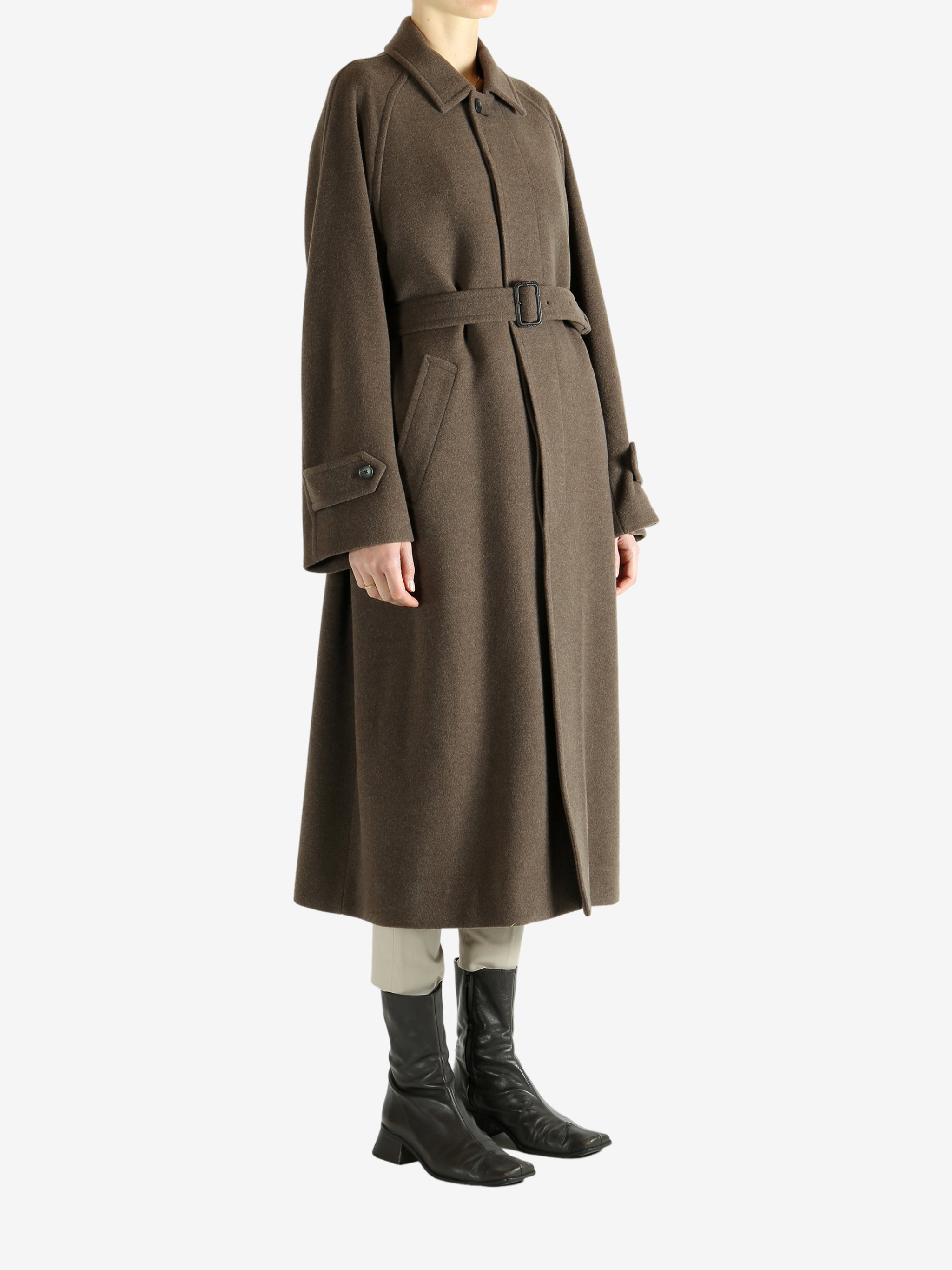 Brown coat worn by a person, showing the coat fit