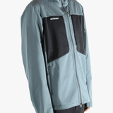 Blue jacket worn by a person, showing the jacket's fit