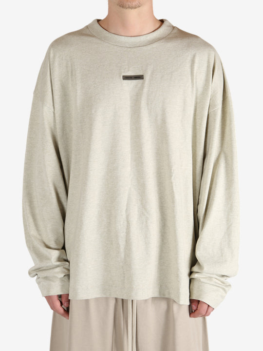 Tan tops worn by a person, showing the tops fit