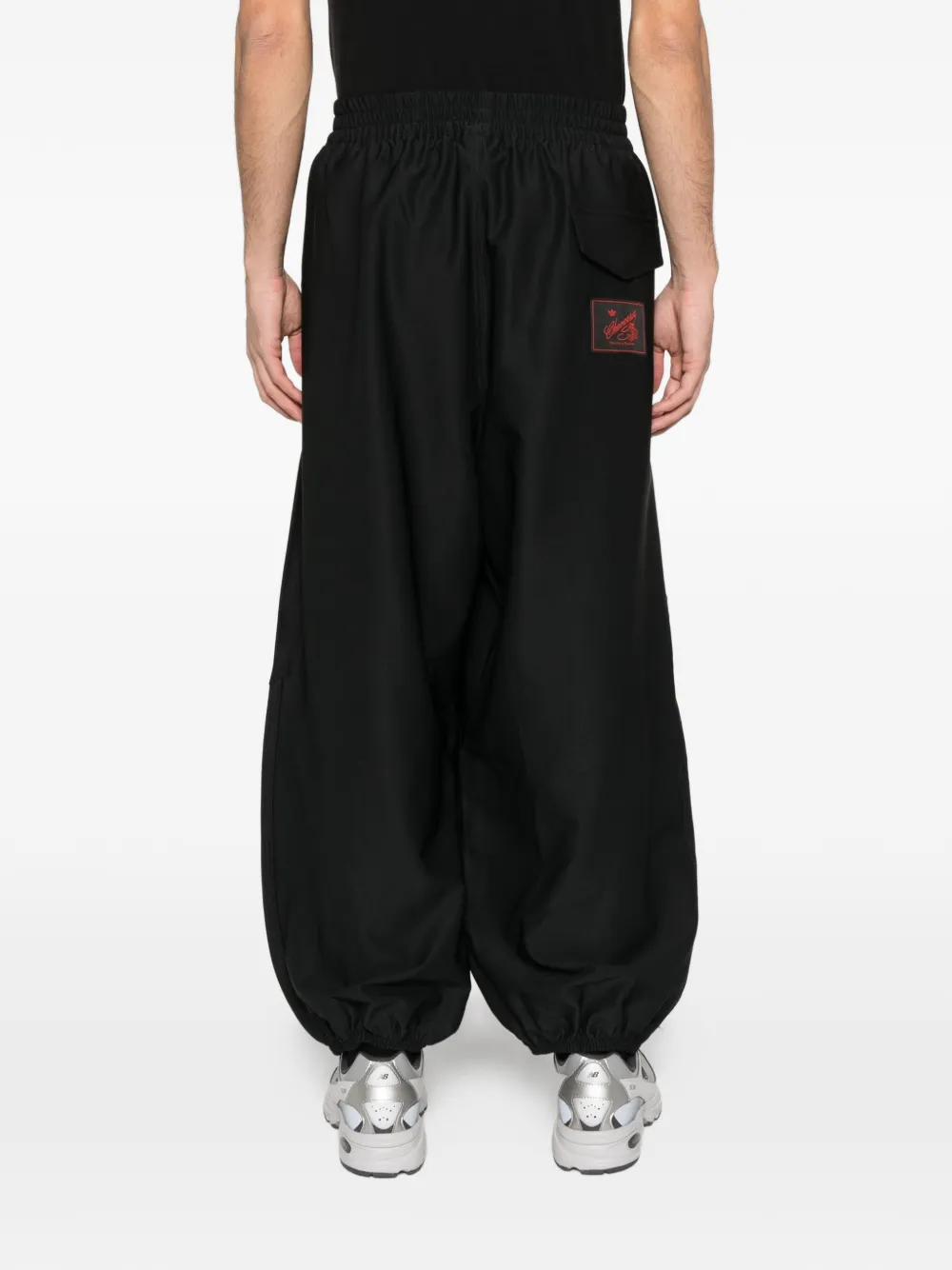 Black pants worn by a person, showing the pants fit