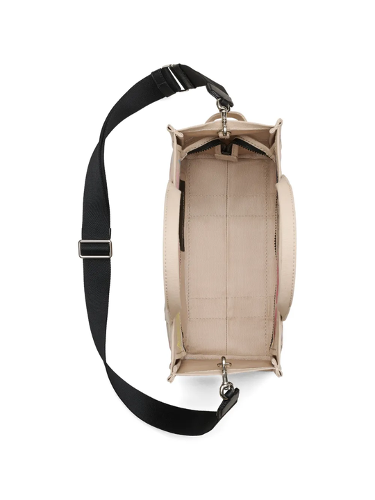 Close up of tan bag, showing texture of the fabric