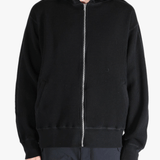 Black hoodie worn by a person, showing the hoodie's fit