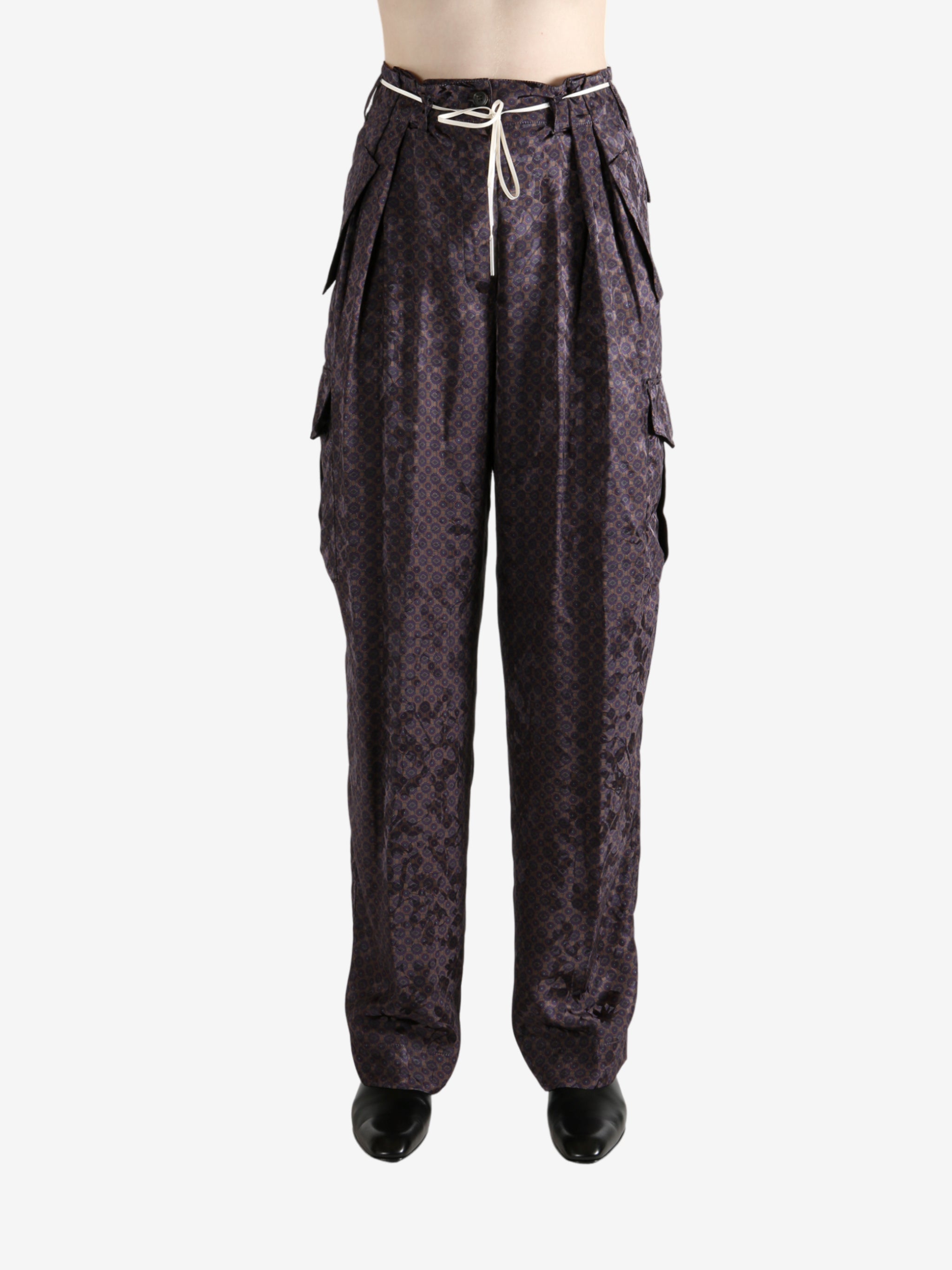 Brown pant worn by a person, showing the pant's fit