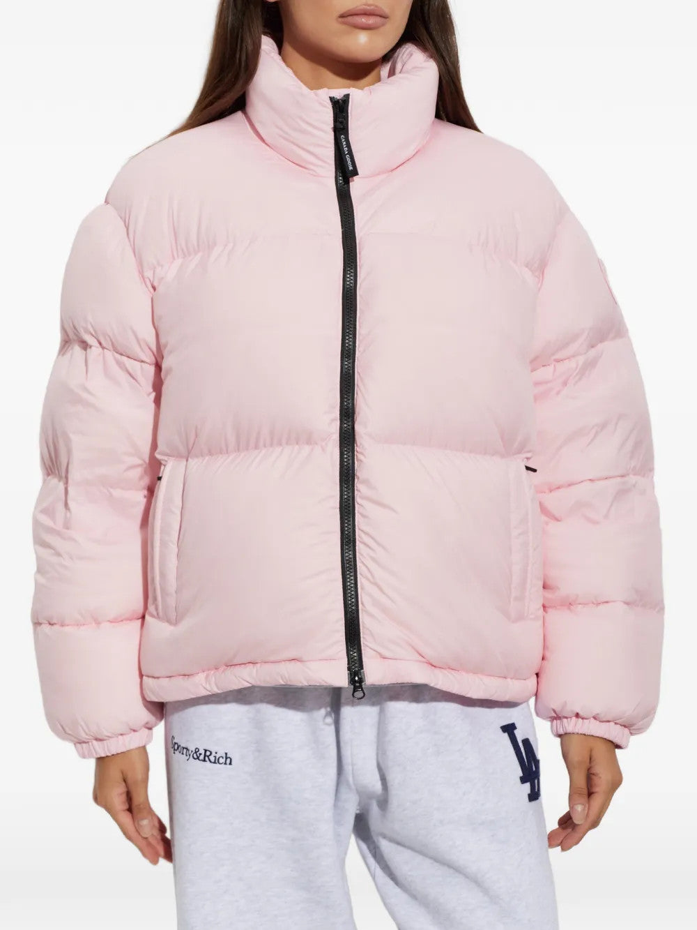 Pink jacket worn by a person, showing the jacket fit