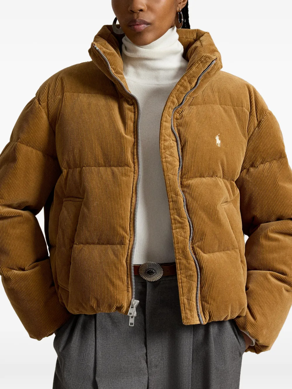 Tan jacket worn by a person, showing the jacket fit