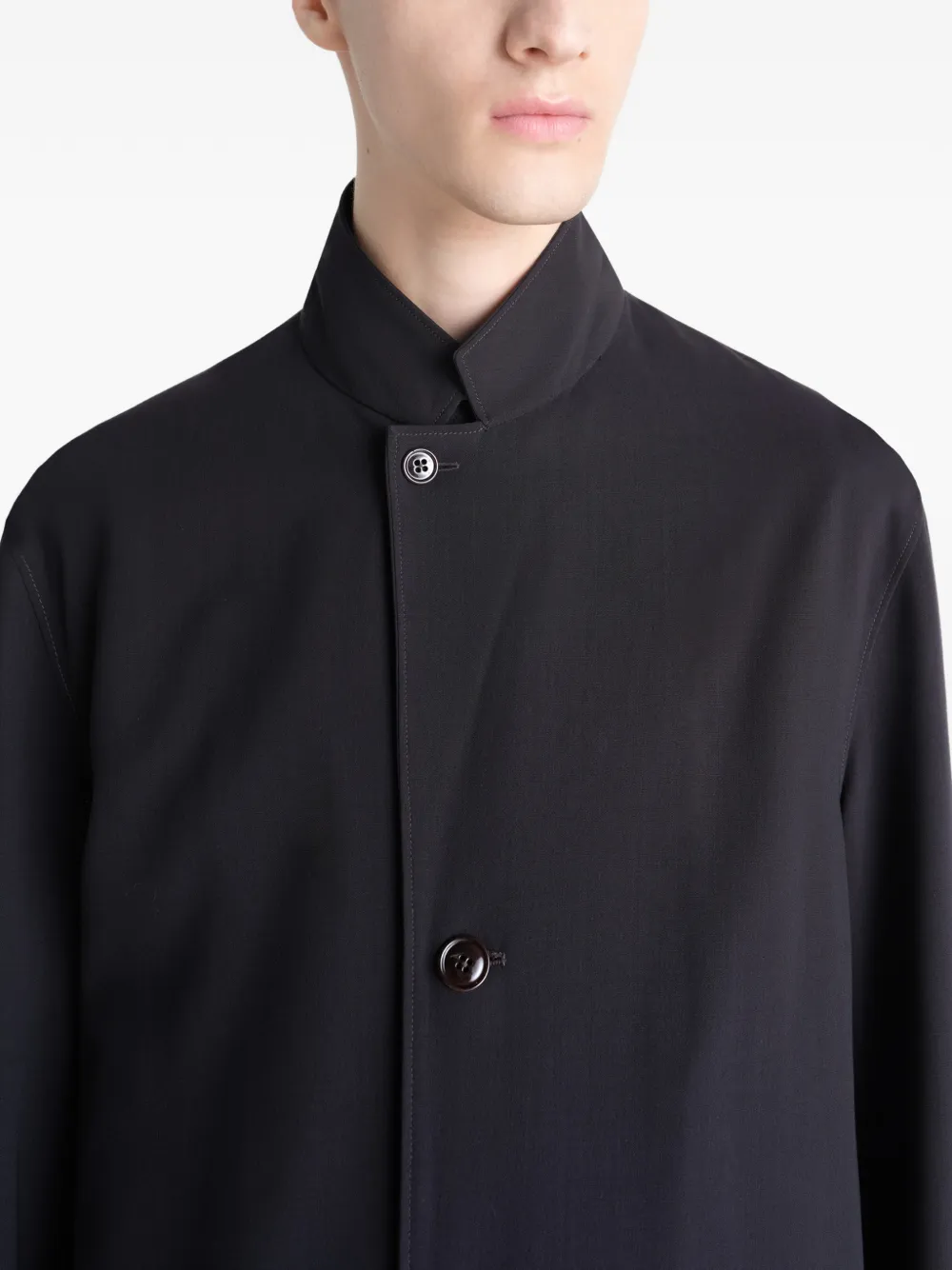 Close up of black coats showing texture of the blended fabric