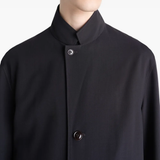 Close up of black coats showing texture of the blended fabric