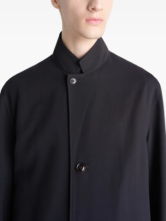 Close up of black coats showing texture of the blended fabric