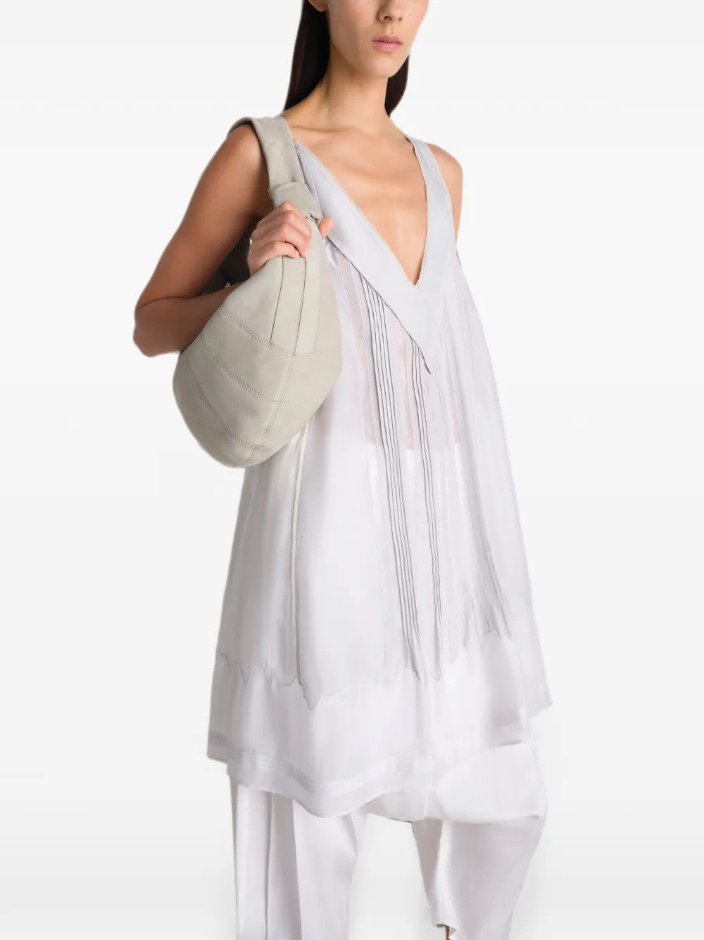 Tan bag worn by a person, showing the bag fit