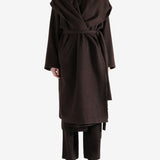 Brown coat worn by a person, showing the coat fit