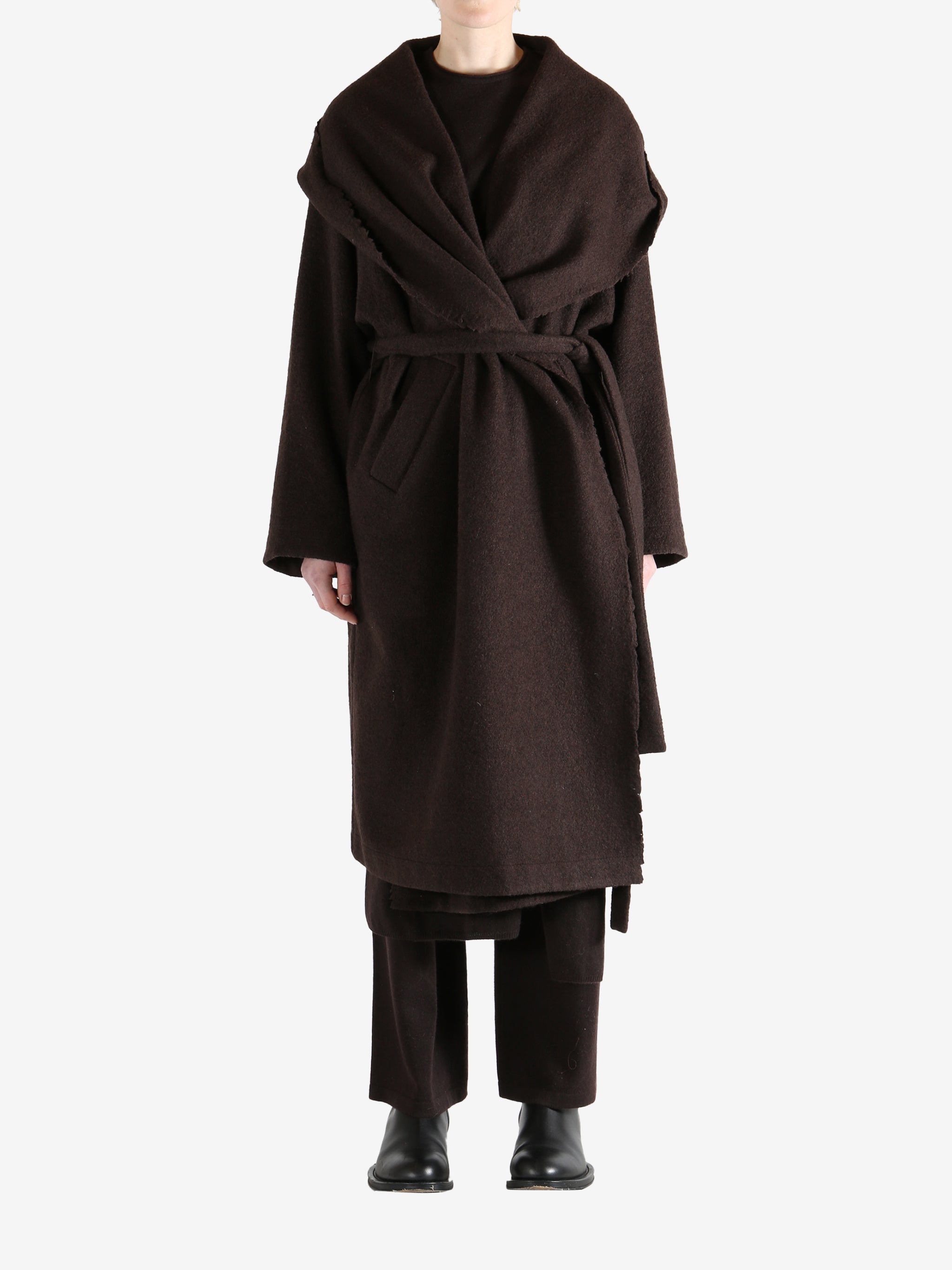 Brown coat worn by a person, showing the coat fit