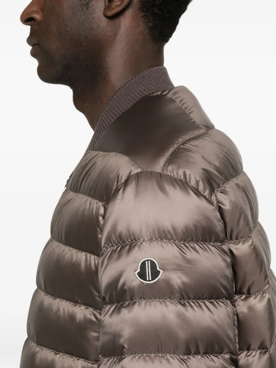 Close up of brown parka, showing the texture of polyster fabric