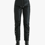 Black pants worn by a person, showing the pants' fit