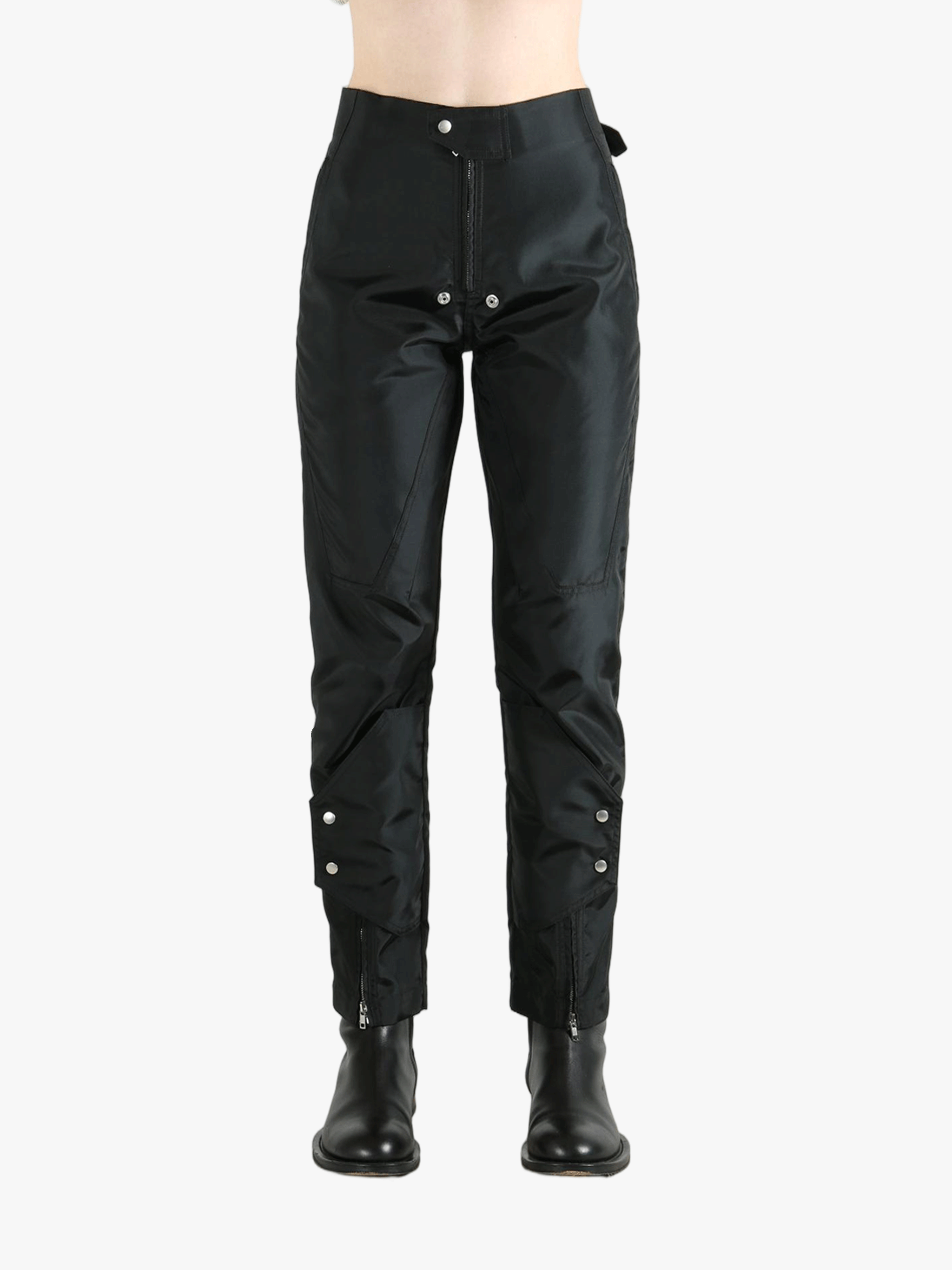 Black pants worn by a person, showing the pants' fit
