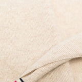 Close up of Tan scarf, showing texture of the 88% cashmere/ 10% nylon/ 2% elastane fabric