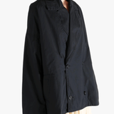 Black jacket worn by a person, showing the jacket fit