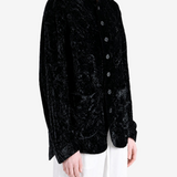 Black jacket worn by a person, showing the jacket fit