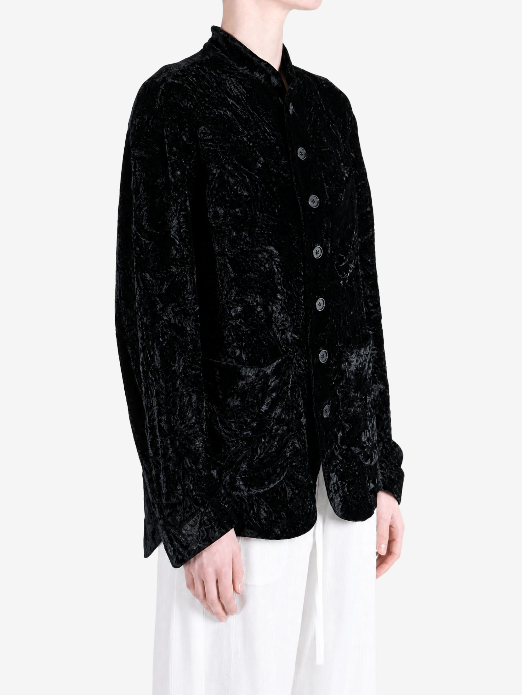 Black jacket worn by a person, showing the jacket fit