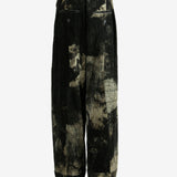 Black pants worn by a person, showing the pants fit