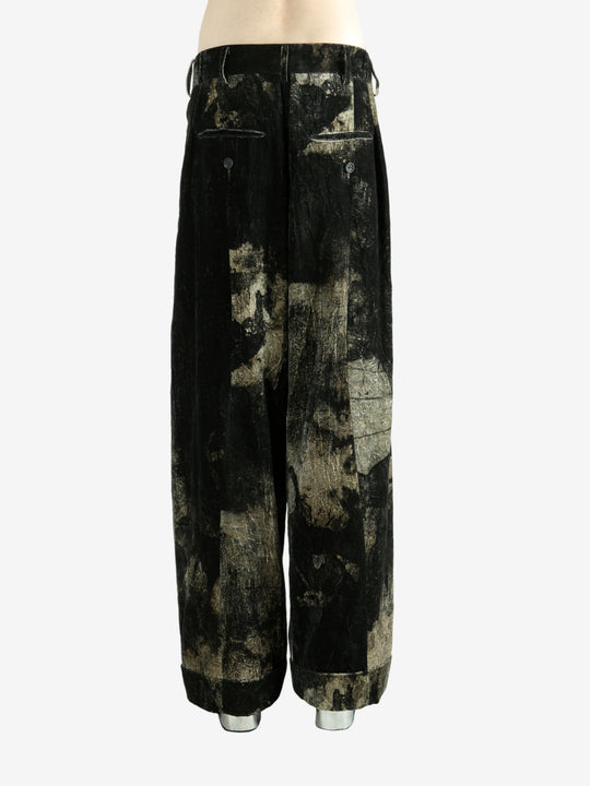 Black pants worn by a person, showing the pants fit