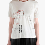 White shirt worn by a person, showing the shirt's fit