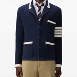 Navy knitwear worn by a person, showing the knitwear fit
