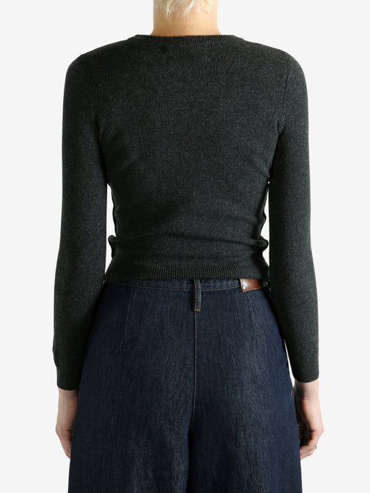 Grey sweater worn by a person, showing the sweater's fit