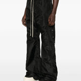 Black pants worn by a person, showing the pants' fit