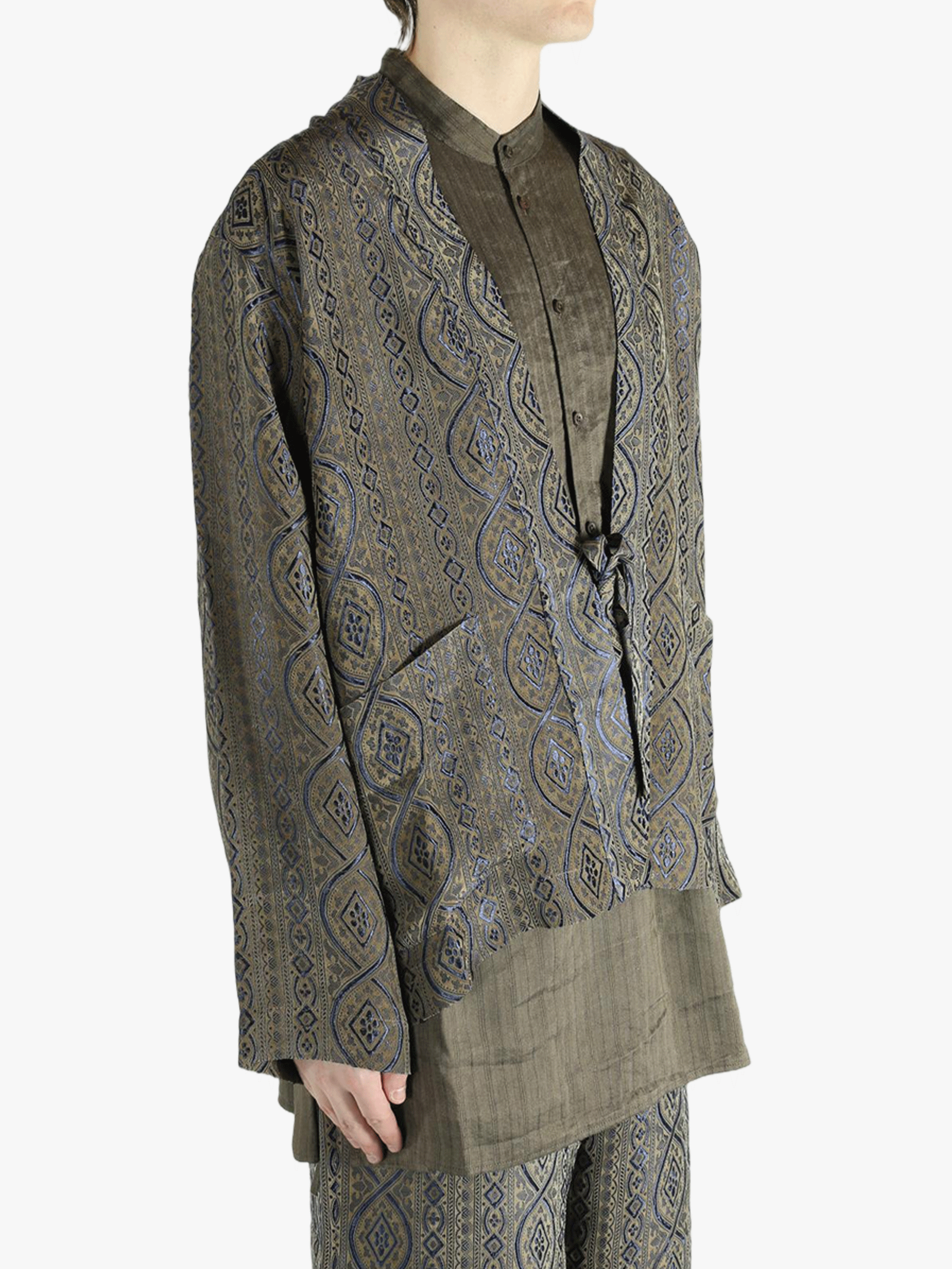 Blue jacket worn by a person, showing the jacket's fit