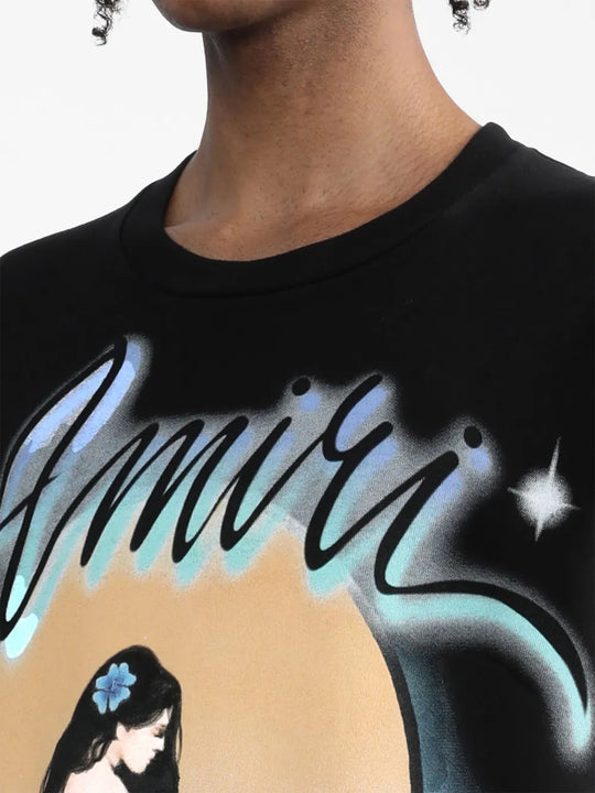 Black t-shirt worn by a person, showing the t-shirt fit
