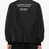 Black jacket worn by a person, showing the jacket's fit