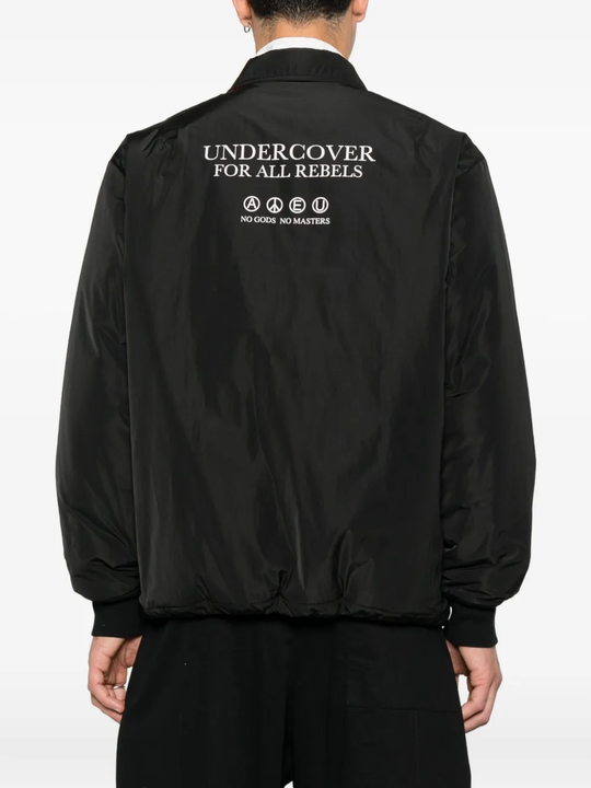 Black jacket worn by a person, showing the jacket's fit