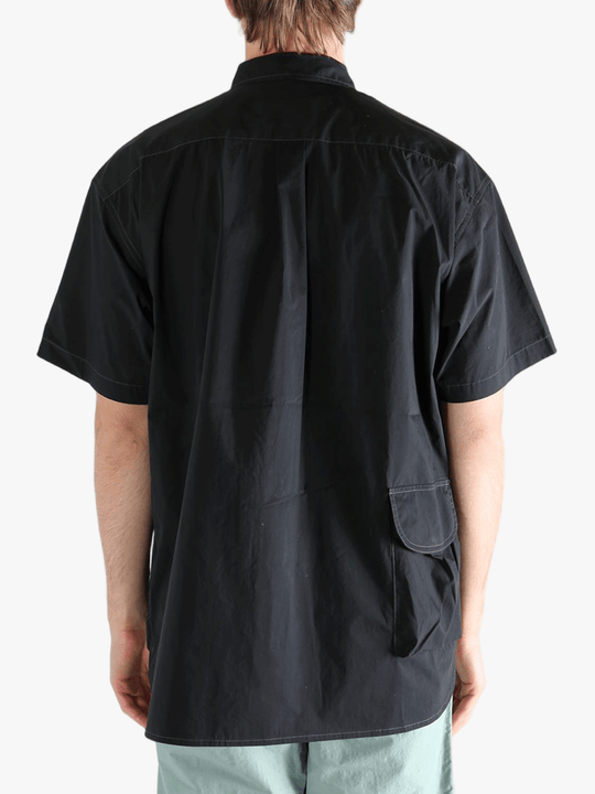 Black shirts worn by a person, showing the shirts fit