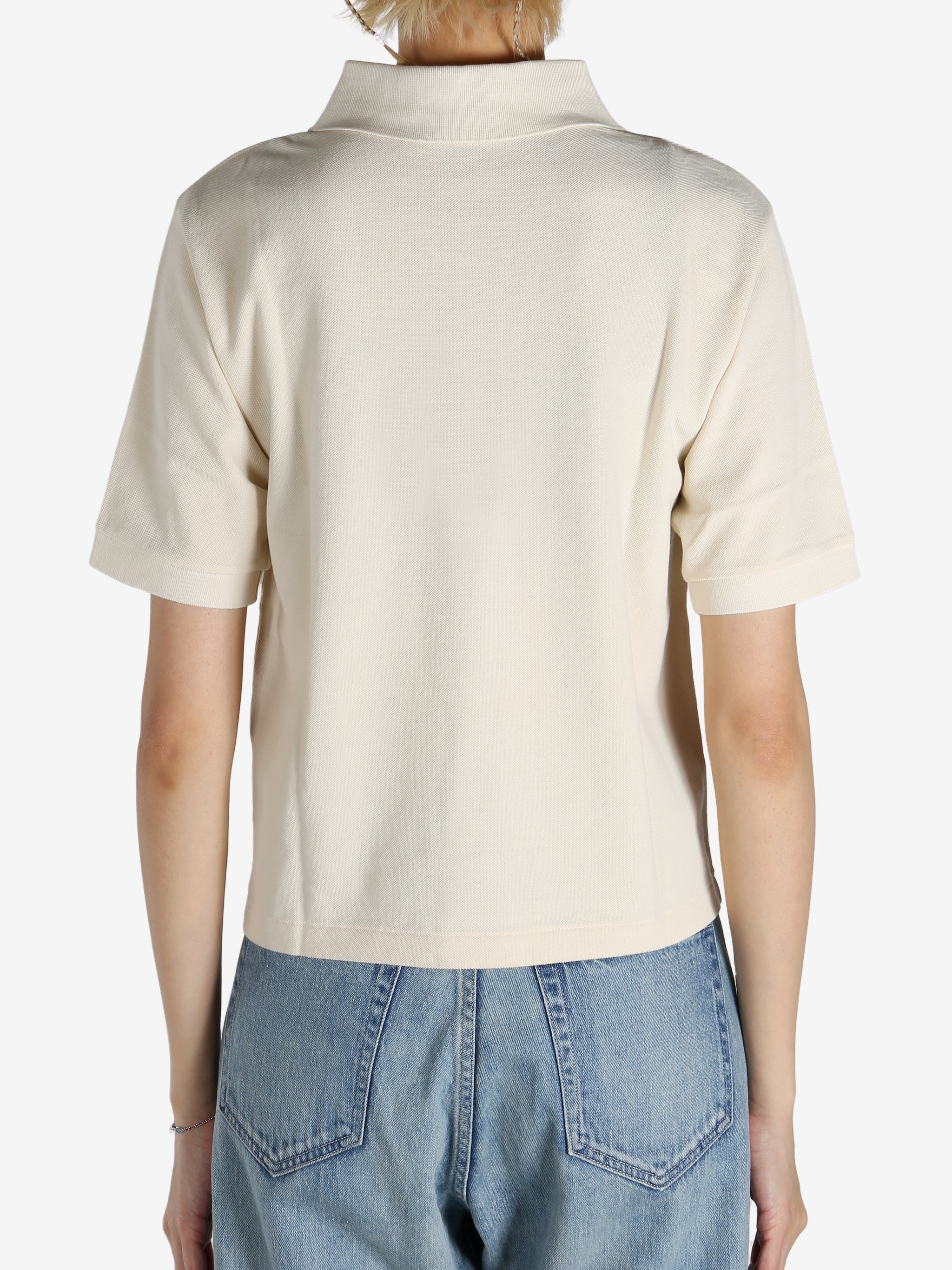 White shirt worn by a person, showing the shirt's fit