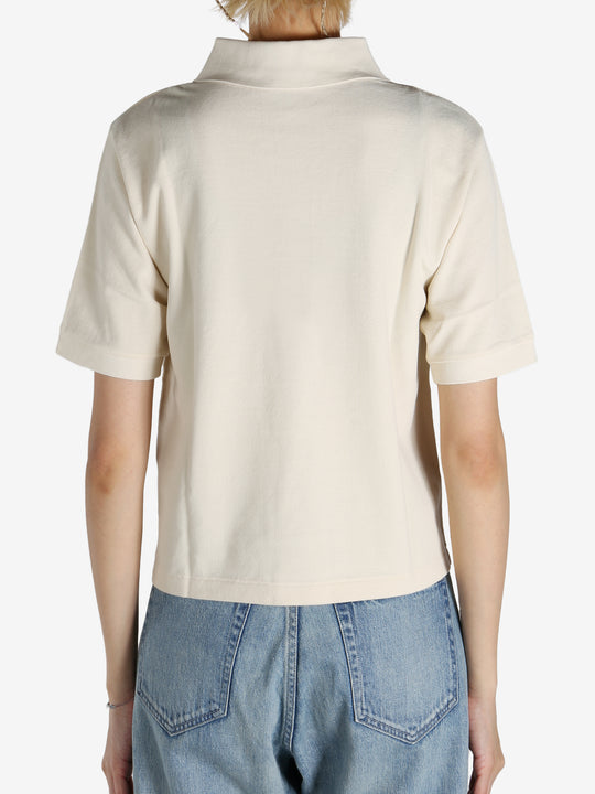 White shirt worn by a person, showing the shirt's fit