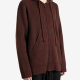 Brown top worn by a person, showing the top fit