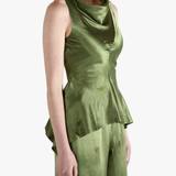 Green tops worn by a person, showing the tops fit