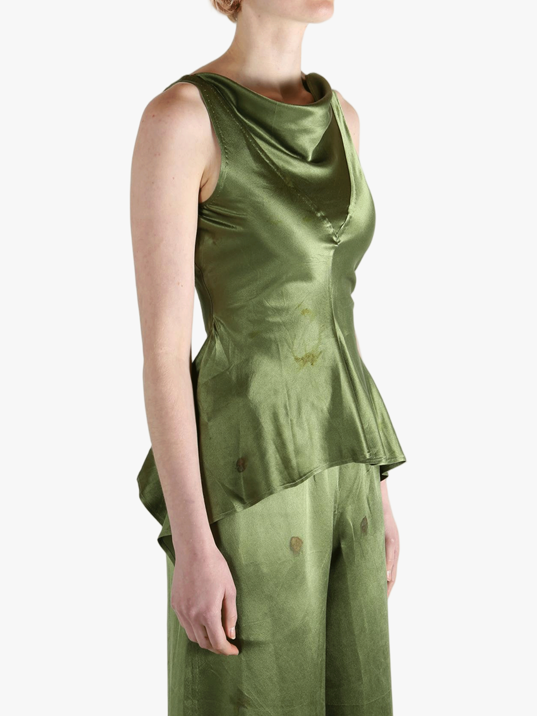 Green tops worn by a person, showing the tops fit