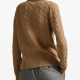 Brown knitwear worn by a person, showing the knitwear fit