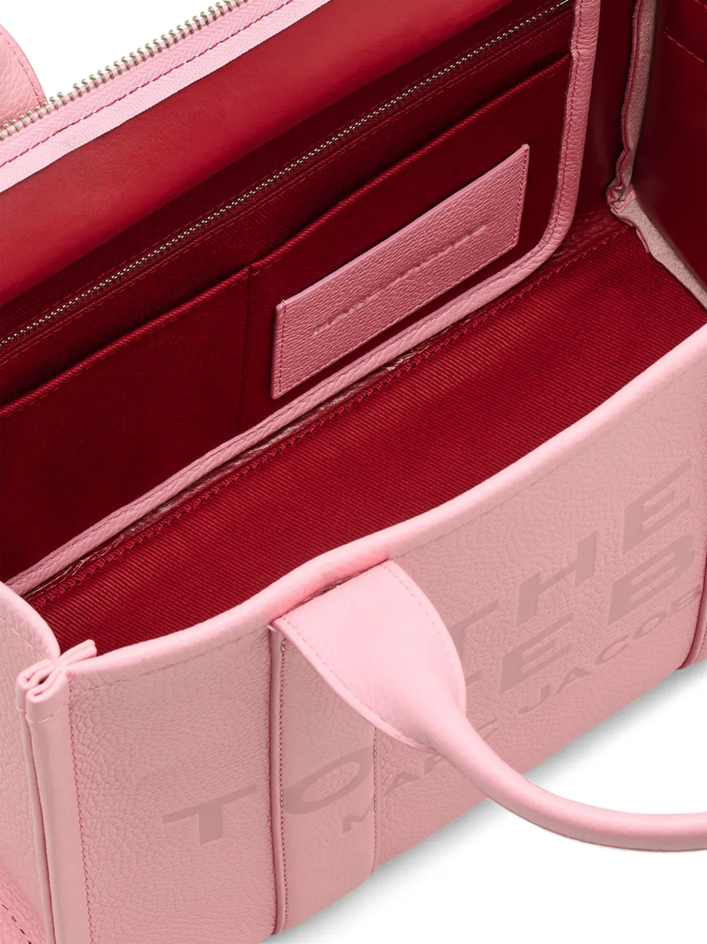 close up of pink bags, showing texture of the leather fabric