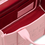 close up of pink bags, showing texture of the leather fabric