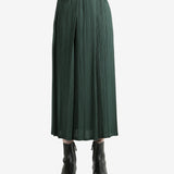 Green skirt worn by a person, showing the skirt's fit