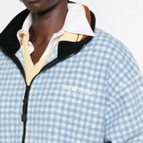 Blue jacket worn by a person, showing the jacket fit