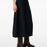  Black skirt worn by a person, showing the skirt fit