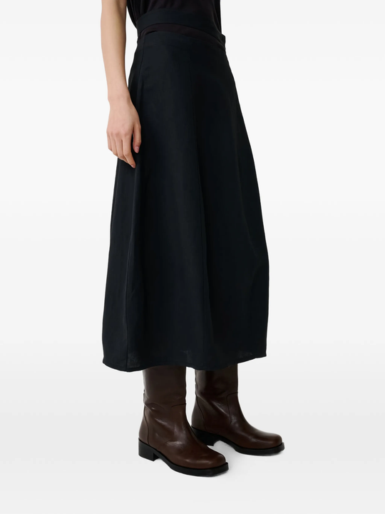  Black skirt worn by a person, showing the skirt fit