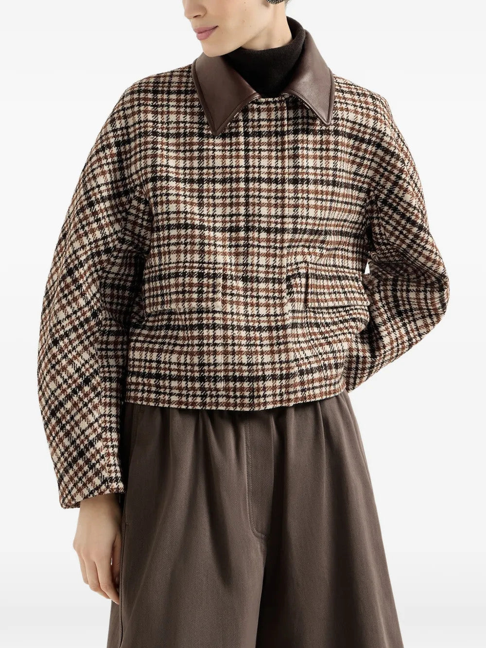 Brown jacket worn by a person, showing the jacket fit